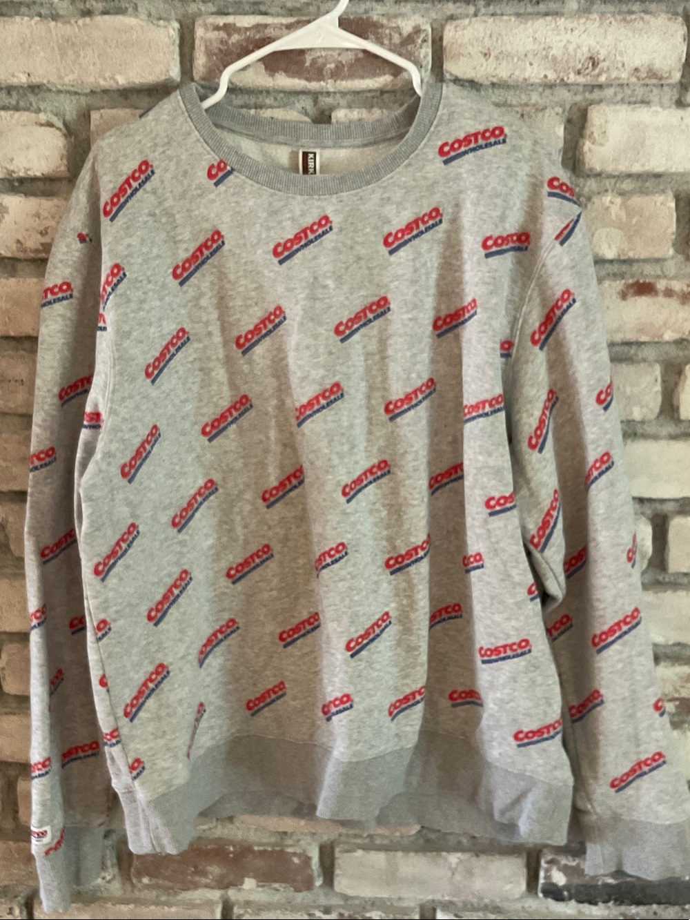 Kirkland Signature Gray Crewneck Sweatshirt with Red Logo Print